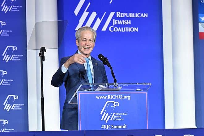 Norm Coleman, a former U.S. senator and national board chair of the Republican Jewish Coalition, speaks at the RJC annual summit in Las Vegas on Oct. 28, 2023. Credit: Courtesy of the RJC.