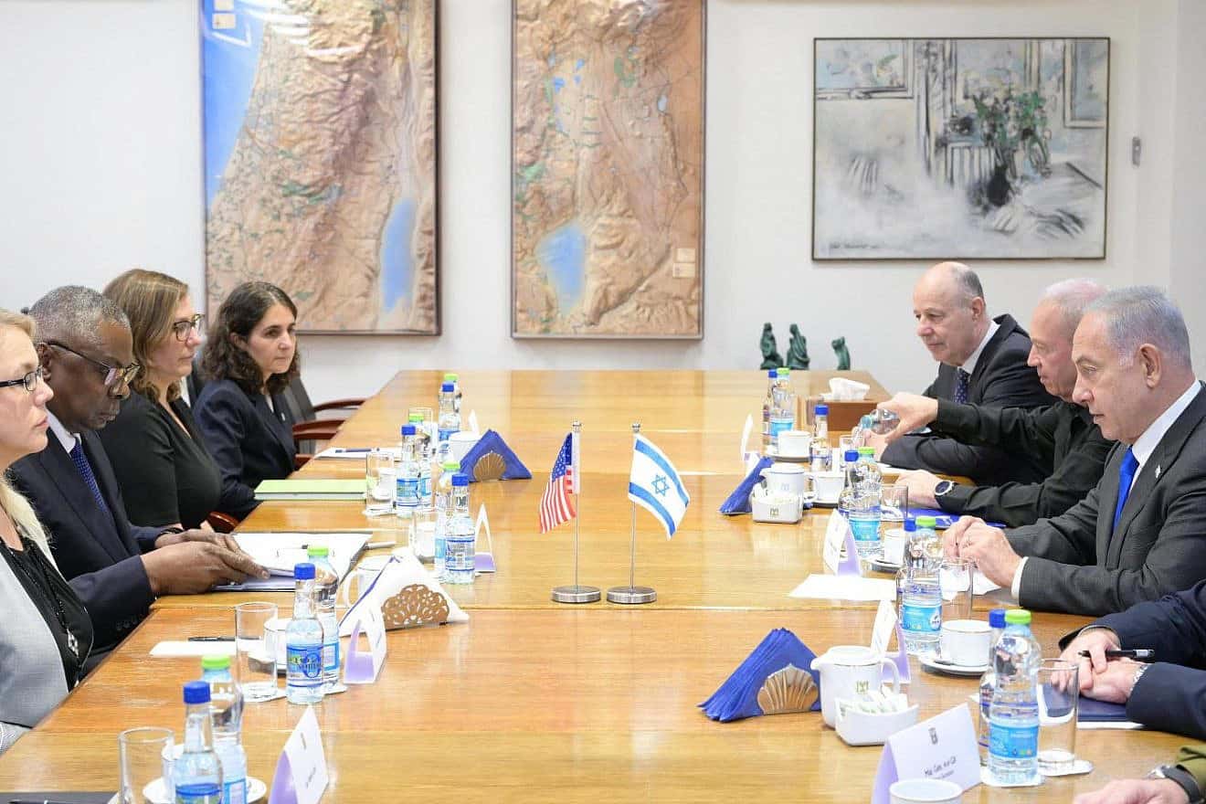 U.S. Secretary of Defense Lloyd Austin and staff (left) meet in Tel Aviv with Israeli Prime Minister Benjamin Netanyahu and staff on Oct. 13, 2023. Photo by Amos Ben-Gershom/GPO,