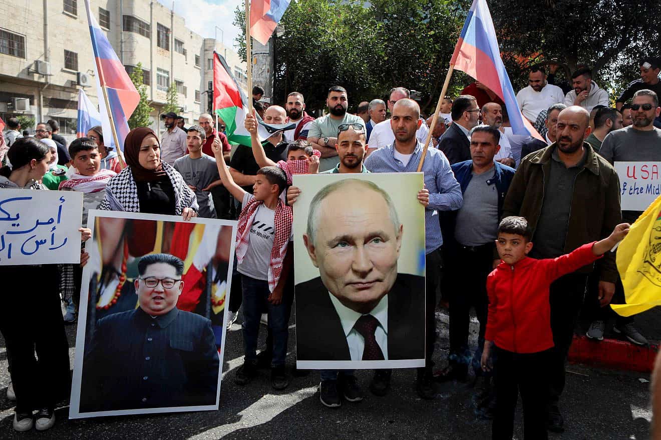 Palestinians in Hebron protest on behalf of their brethren in Gaza, with posters of Russian President Vladimir Putin and North Korean leader Kim Jong-un, following Hamas's Oct. 7 massacre of Israelis., Oct. 20, 2023. Photo by Wisam Hashlamoun/Flash90.
