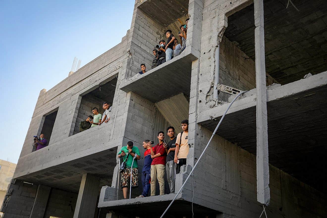 Palestinians observe the aftermath of an Israeli airstrike in Rafah, in the southern Gaza Strip, on Oct. 26, 2023. Photo by Abed Rahim Khatib/Flash90..