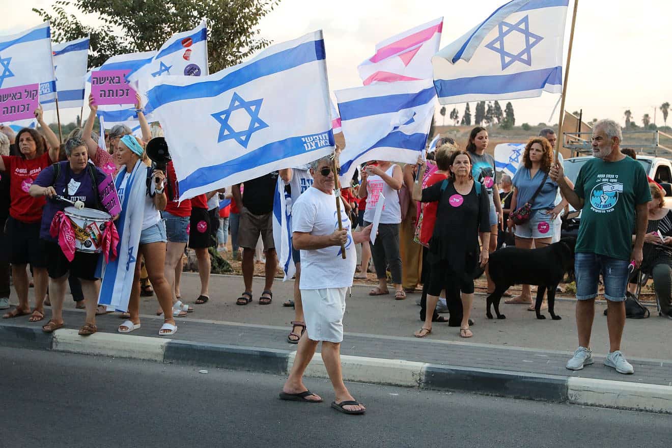 Israelis protest outside Camp Dotan (Camp 80) in Pardes Hanna-Karkur against the order given to female soldiers in the military camp not to sing on kitchen duty, Aug. 27, 2023. Photo by Anat Hermony/Flash90.