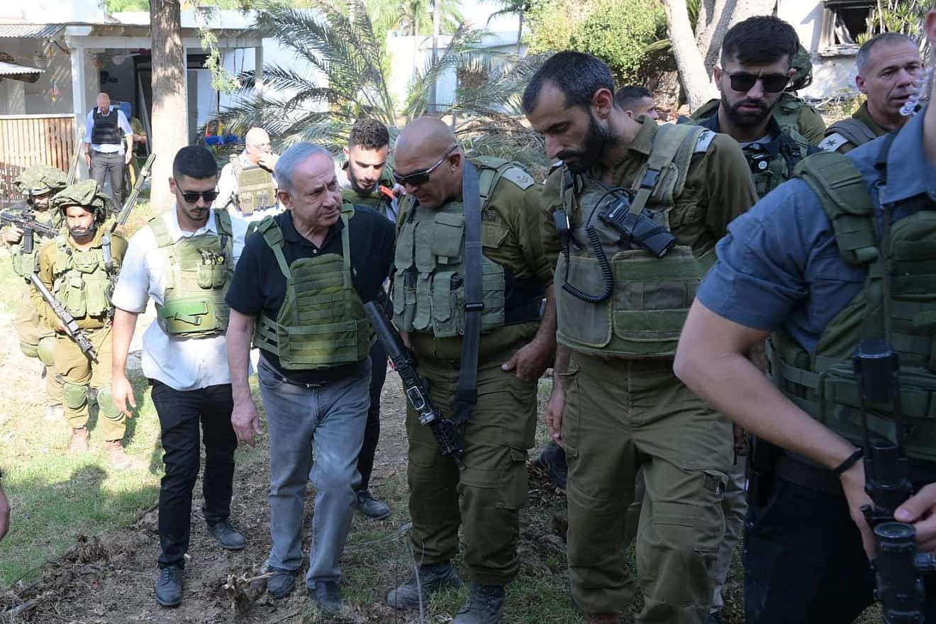 Israeli Prime Minister Benjamin Netanyahu meets with soldiers during a visit to kibbutzim devasted by Hamas terrorists, Oct. 14, 2023. Photo by Avi Ohayon/GPO.