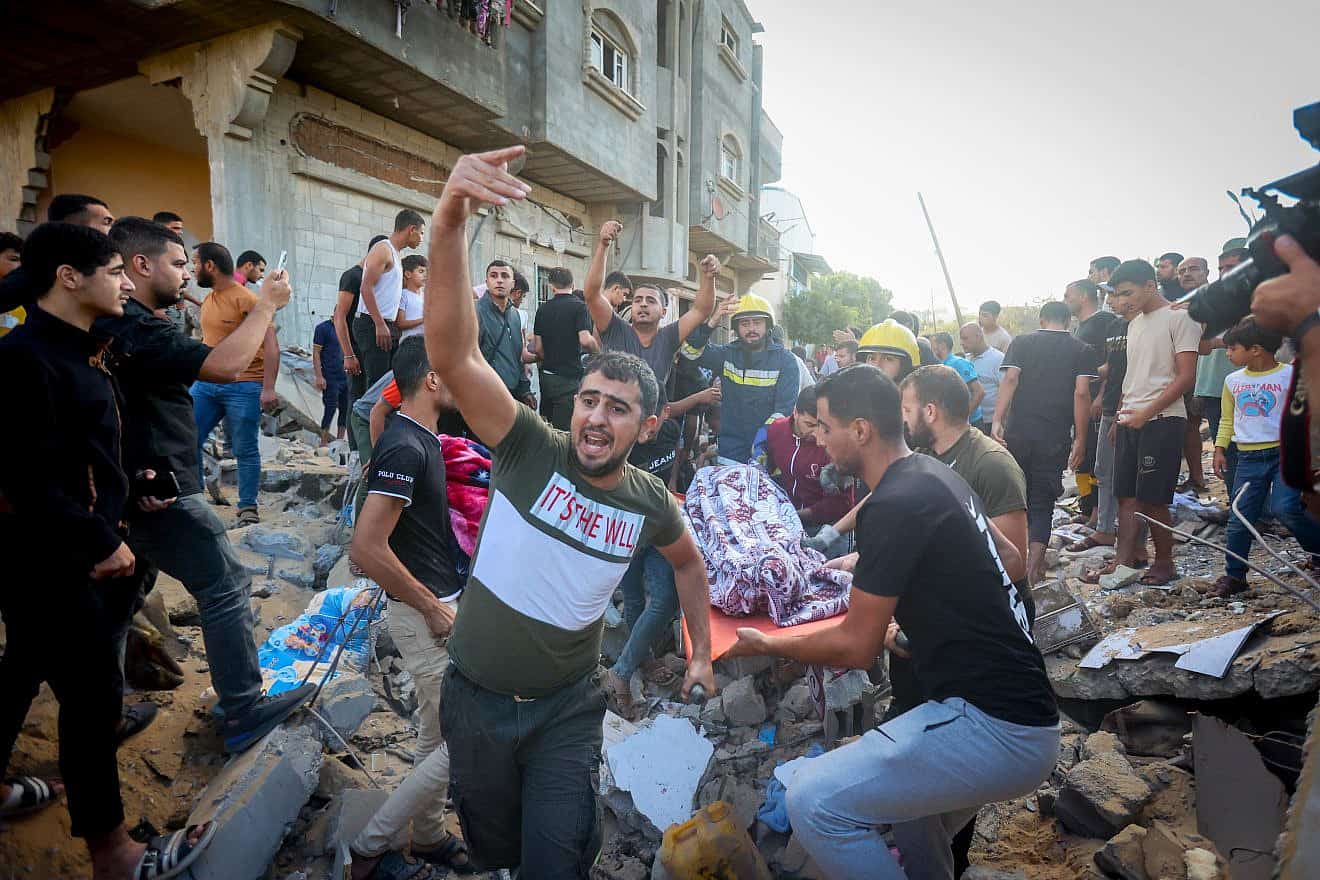 Palestinians look for survivors after an Israeli airstrike in Khan Yunis in the southern Gaza Strip, on Oct. 16, 2023. Photo by Atia Mohammed/Flash90.