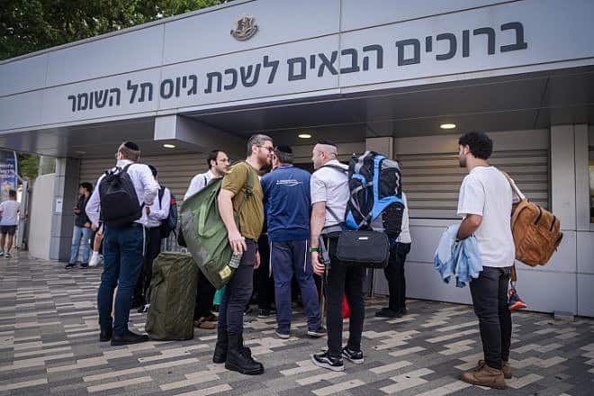 Haredi men who decided to join the IDF arrive at the army's recruitment office at Camp Yaakov Dori in Ramat Gan's Tel Hashomer neighborhood, Oct. 23, 2023. Photo by Avshalom Sassoni/Flash90.
