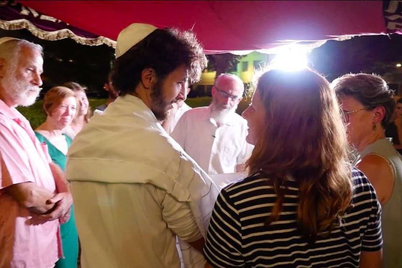 Uri Mintzer (left) and Elinor Yosefin exchange wedding vows in the Israeli town of Shoham before reporting for reserve duty, Oct. 9, 2023. Photo by Avi Friedman.