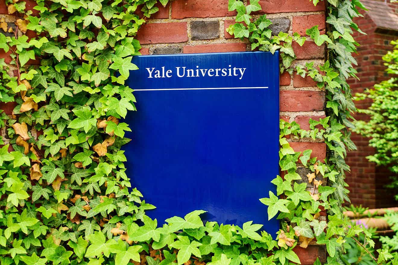 Yale University sign on one of its brick buildings in New Haven, Conn. Credit: Michael Vi/Shutterstock.