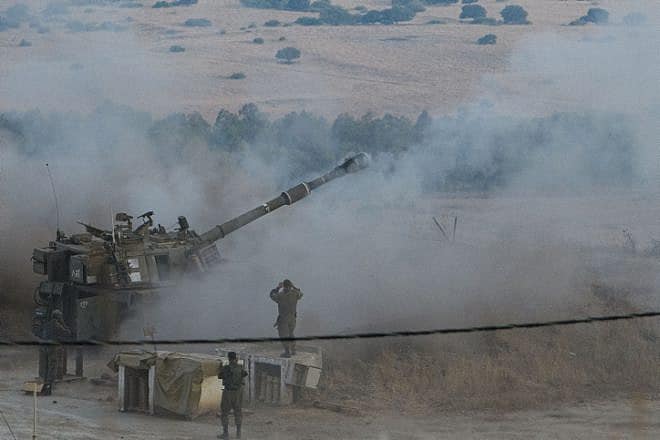 An IDF Artillery Corps cannon fires shells during a drill near the border with Lebanon, Aug. 28, 2023. Photo by Ayal Margolin/Flash90.