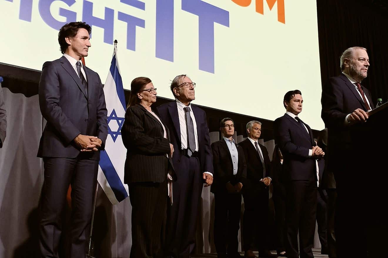 The former Canadian politician Irwin Cotler (center, back row) receives an award at the "Antisemitism: Face It, Fight It" two-day conference in Ottawa as others, including Canadian Prime Minister Justin Trudeau (second from left) look on, Oct. 17, 2023. Photo by Dave Gordon.