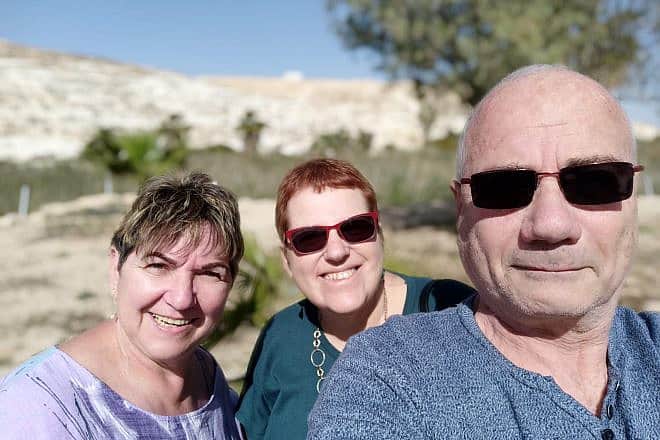 Vivian Roitman (center) with her neighbors, Louis and Carla, who along with three other members of their family were kidnapped by Hamas terrorists and taken to the Gaza Strip on Oct. 7, 2023. Credit: Courtesy.