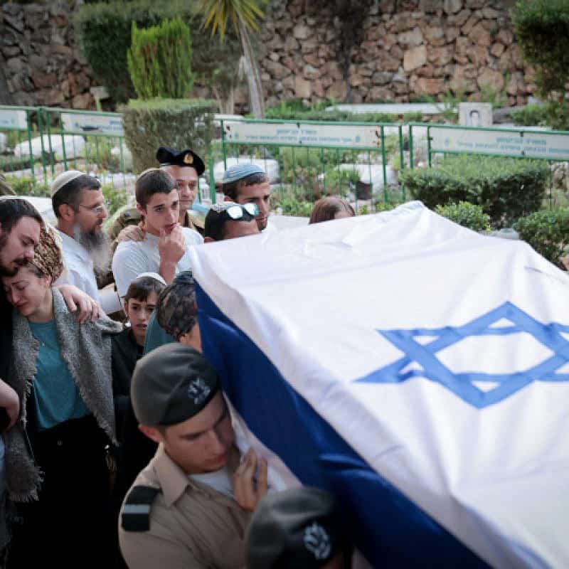 Mourners attend the funeral of IDF soldier David Shila at the Mount Herzl Military Cemetary in Jerusalem, Oct. 8, 2023. Photo by Noam Revkin Fenton /Flash90.