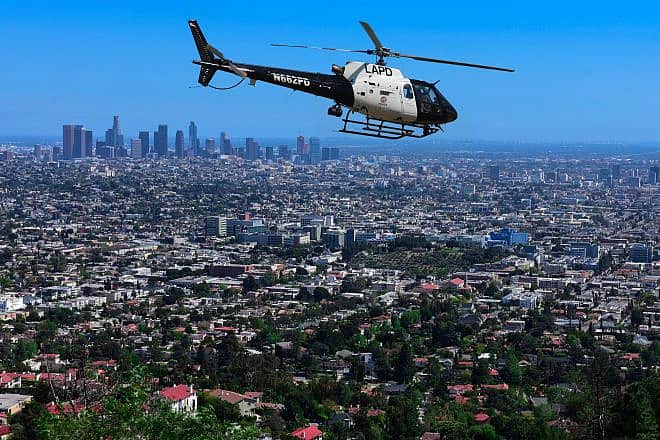 An LAPD helicopter over Los Angeles. Photo by Biker x days/Shutterstock.