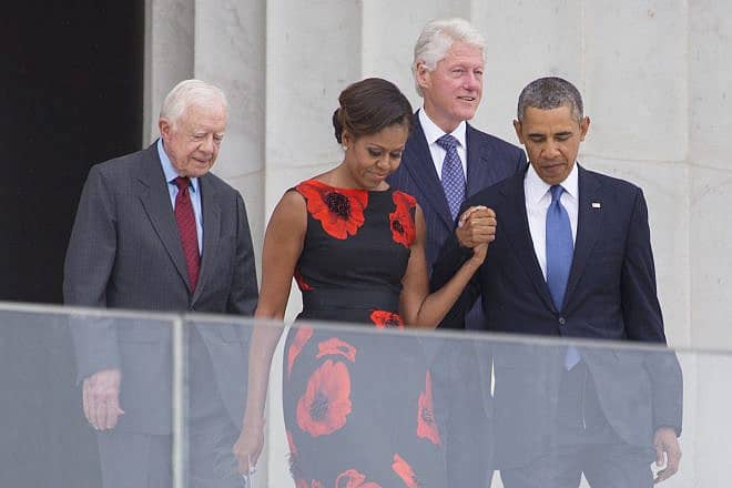 (From left) Former President Jimmy Carter, then First Lady Michelle Obama, former President Bill Clinton, and then President Barack Obama at the 50th anniversary of the March on Washington for Jobs and Freedom Aug. 28, 2013. Credit: Joseph Sohm/Shutterstock.