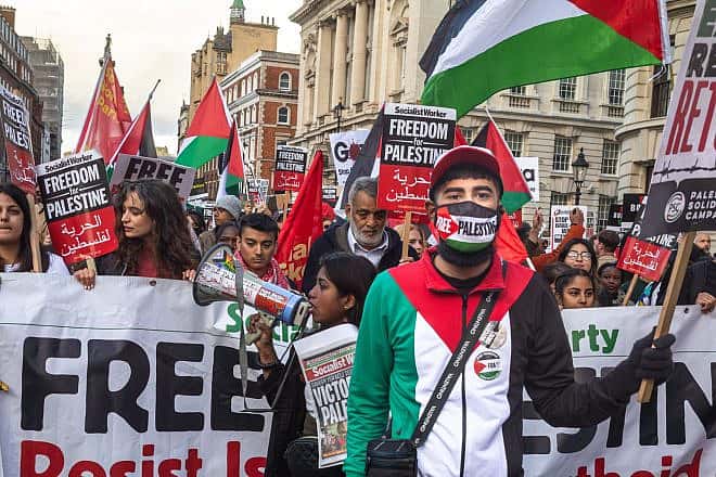 Anti-Israel andpro-Palestinian demonstrators march through central London in support of the Hamas terrorist group, Oct. 14, 2023. Credit: Andy Soloman/Shutterstock