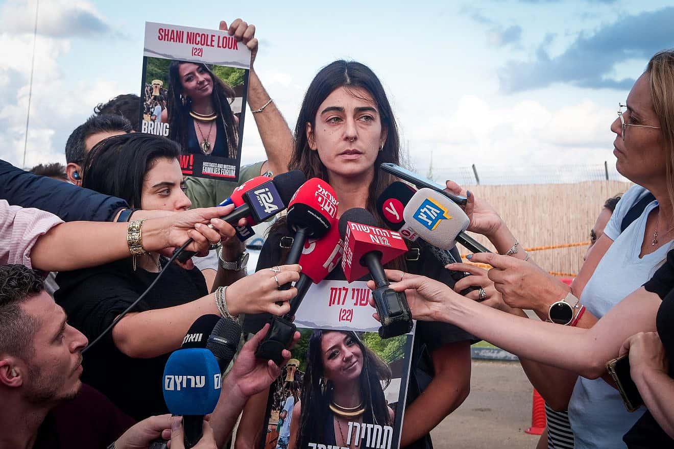A cousin of Shani Louk, who was first thought abducted by Hamas terrorists in the attacks on Oct. 7 but later revealed to have been one of 1,400 people murdered that Saturday morning in southern Israel, speaks to the media outside the Home Front Command base in Ramla on Oct. 15, 2023. Photo by Avshalom Sassoni/Flash90.