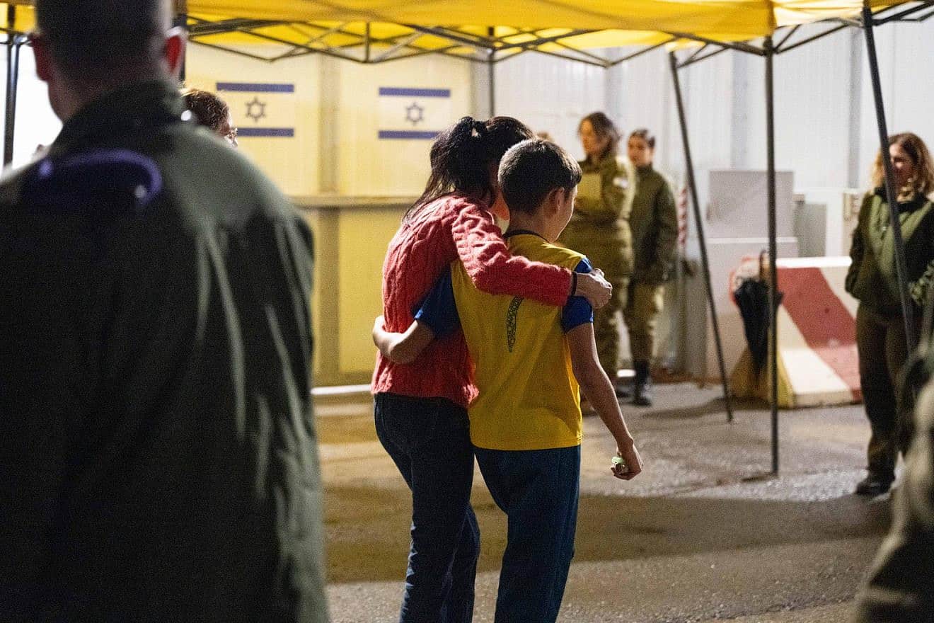 Freed Israeli hostage Eitan Yahalomi, 12, meets his mother upon his return to Israel at the Kerem Shalom Crossing on Nov. 27, 2023. Credit: IDF Spokesperson.