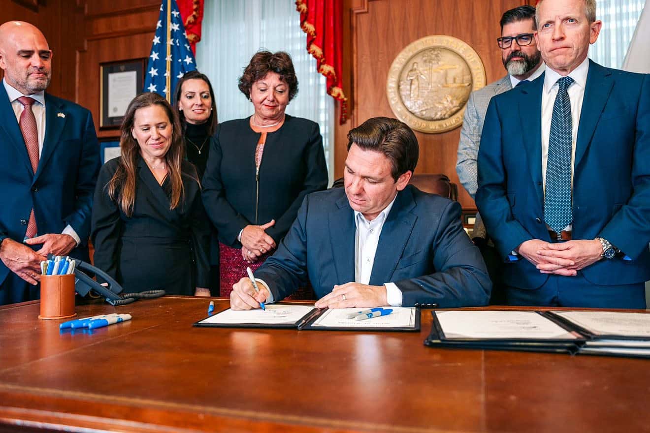 Florida Governor Ron DeSantis signs the historic bill to increase security funding for Jewish institutions.