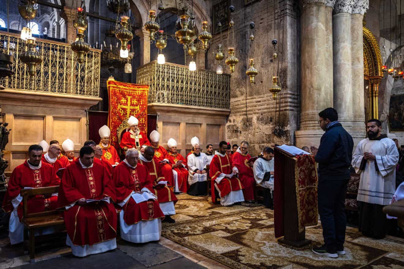 Members of the clergy and the local catholic community attend a mass for the late Pope Emeritus Benedict XVI, led by the Latin Patriarch Pierbattista Pizzaballa at the Church of the Holy Sepulchre, in Jerusalem's Old City on Jan. 10, 2023. Photo by Olivier Fitoussi/Flash90.