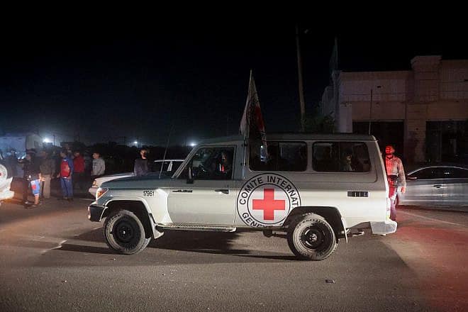 Red Cross vehicles carry released hostages released from Hamas captivity at the Rafah border crossing between Egypt and the Gaza Strip, on Nov. 24, 2023. Photo by Atia Mohammed/Flash90.