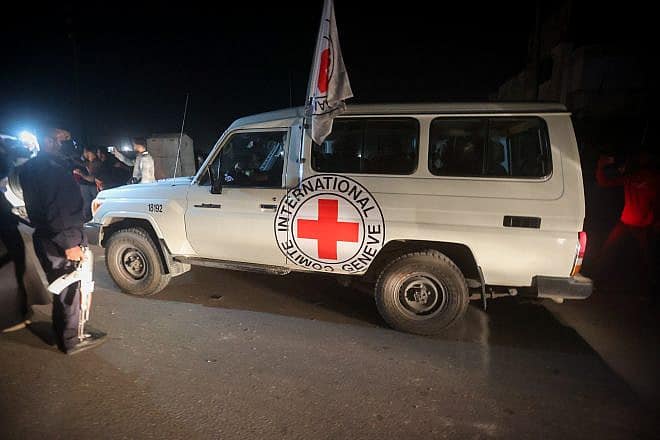 Red Cross vehicles carry released hostages at the Rafah Crossing between Egypt and the Gaza Strip, Nov. 24, 2023. Photo by Atia Mohammed/Flash90.