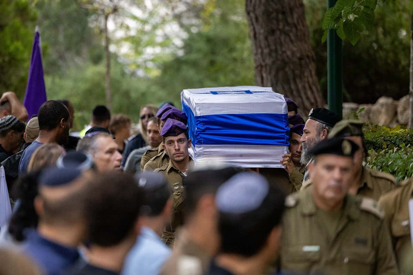 Family and friends of IDF Staff Sgt. Lavi Lipshitz, 20, mourn at his funeral at the Mount Herzl Military Cemetery in Jerusalem on Nov. 1, 2023. Photo by Yonatan Sindel/Flash90.