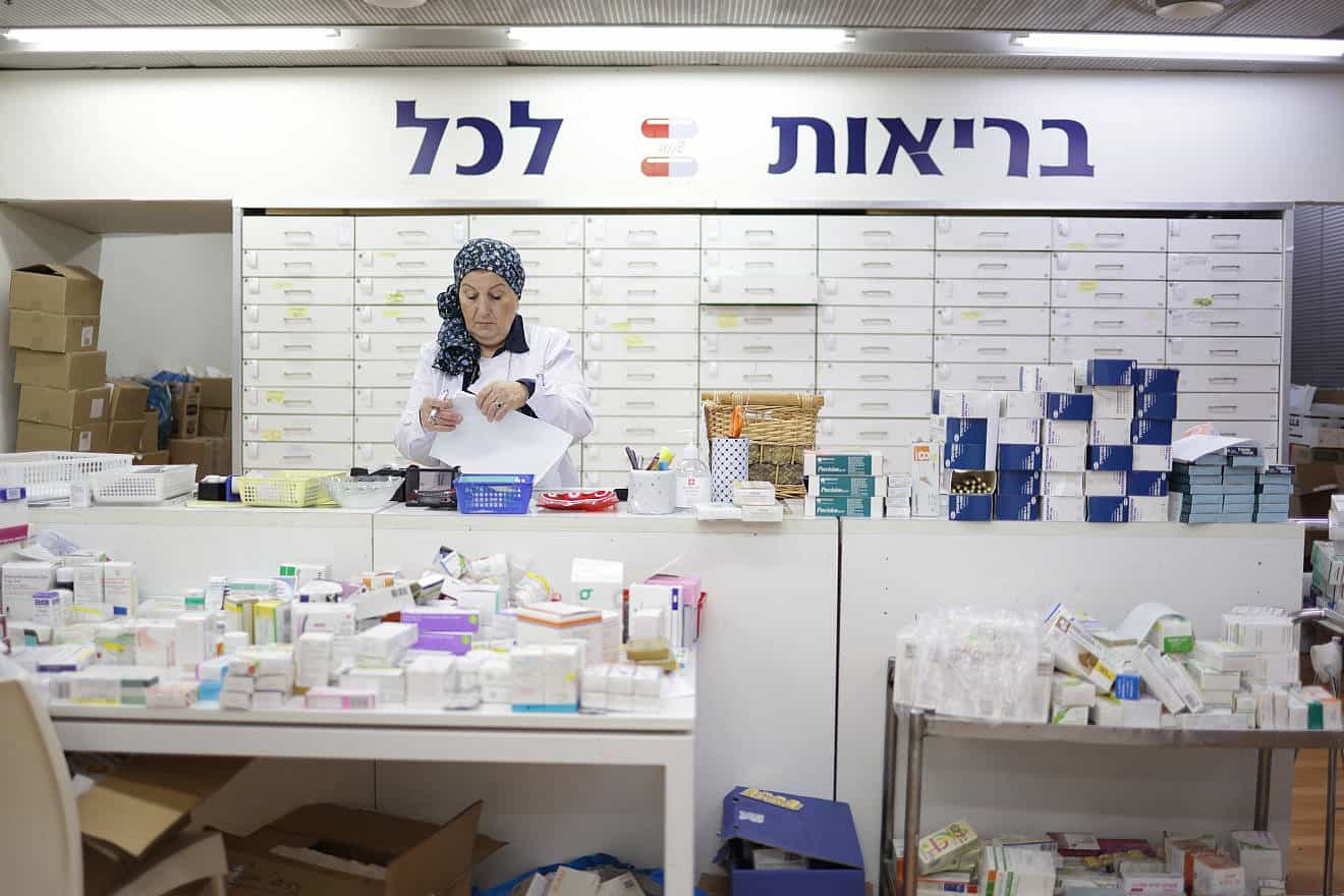 Yad Sarah Pharmacist Sorting Medication for Distribution. Credit: Daniel Jankovic