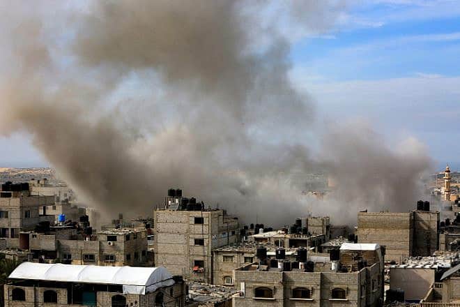 Smoke rises after Israeli air strikes as seen from Khan Younis, in the southern Gaza Strip, Nov. 11, 2023. Photo by Abed Rahim Khatib/Flash90.