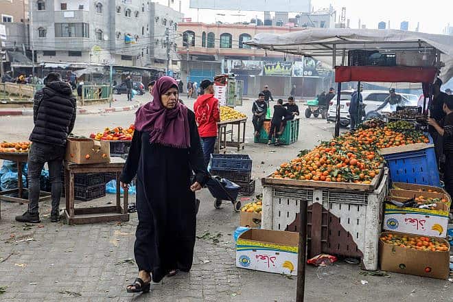 Palestinians shop for food in Rafah, in the southern Gaza Strip, during a ceasefire between Israel and Hamas, on Nov. 27, 2023. Photo by Abed Rahim Khatib/Flash90.
