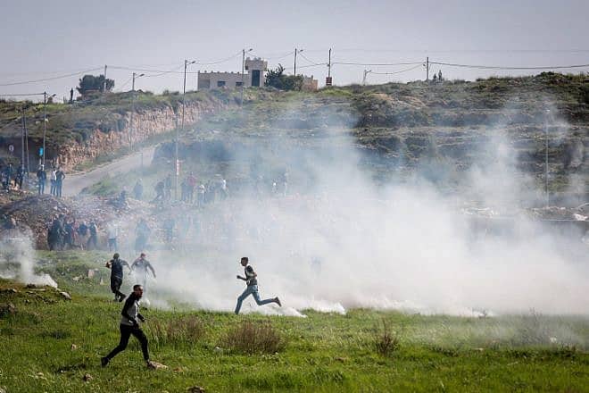 Palestinian rioters clash with Israeli security personnel near Beit El in the Binyamin region of Samaria, April 11, 2022. Credit: Flash90.