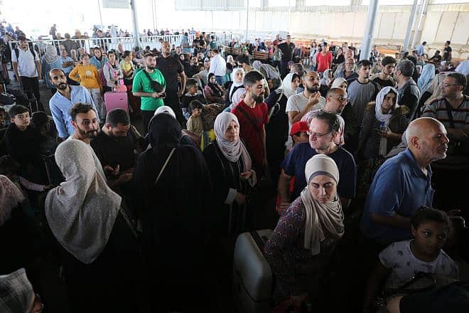 Foreign passport holders wait to enter Sinai from the Gaza Strip after Egypt opened the Rafah border crossing for the first time since the war began, Nov. 1, 2023. Photo by Majdi Fathi/TPS.