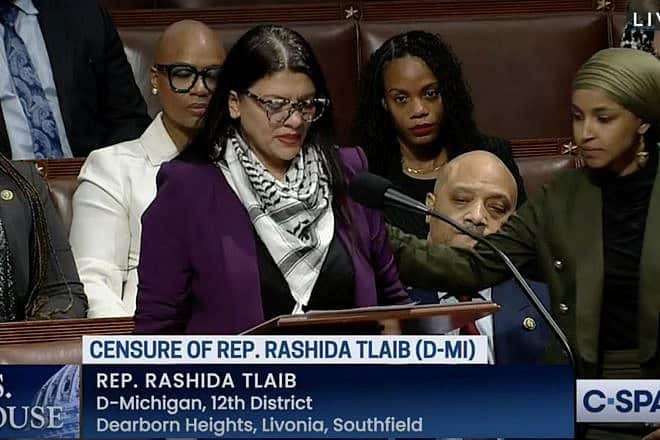 Minnesota Democrat Rep. Ilhan Omar (right) consoles Rep. Rashida Tlaib (D-Mich.), who tears up as she speaks on the House floor on Nov. 7, 2023. Credit: C-SPAN screen capture.