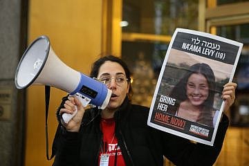 Organizer Shany Granot-Lubaton holds an image of one of the Israeli hostages being held captive in the Gaza Strip at a protest outside the New York City headquarters of U.N. Women on Nov. 27, 2023. Photo by Roi Boshi.