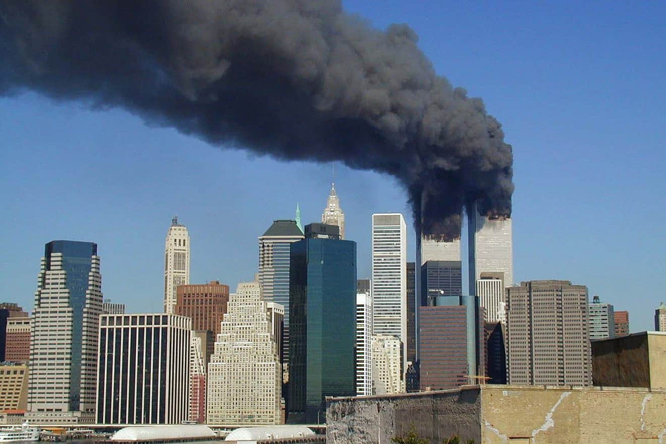 The World Trade Center in Lower Manhattan after a Boeing 767 hit each tower, Sept. 11, 2001. Photo by Michael Foran via Wikimedia Commons.