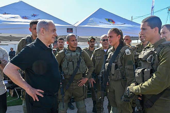 Prime Minister Benjamin Netanyahu with soldiers at the IDF's Zikim Base near the northern Gaza Strip, Nov. 15, 2023. Credit: Kobi Gideon/GPO.