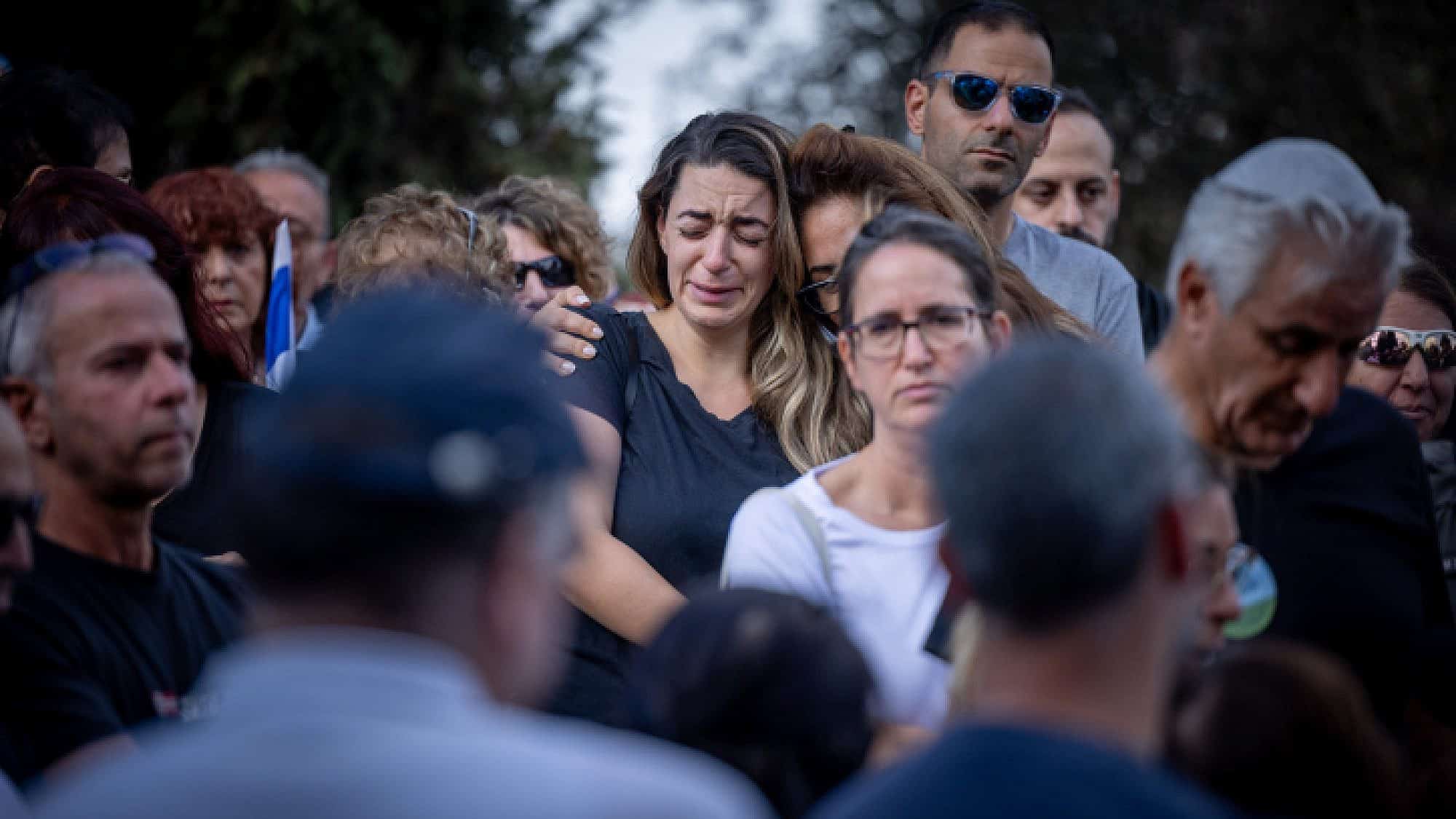 Mourners attend the funeral at Kibbutz Beit Guvrin on Tuesday of Yosef Vahab, whom Hamas terrorists murdered in Kibbutz Nir Oz on Oct. 7. Photo by Yonatan Sindel/Flash90.