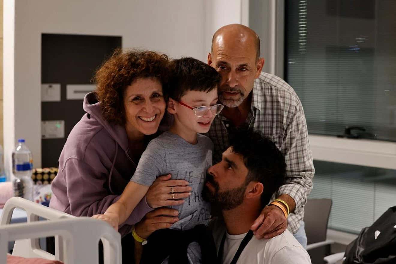 Ohad Monder, 9, reunites with his father and brother after 49 days in Hamas captivity in the Gaza Strip, Nov. 25, 2023. Credit: Schneider Children's Hospital.