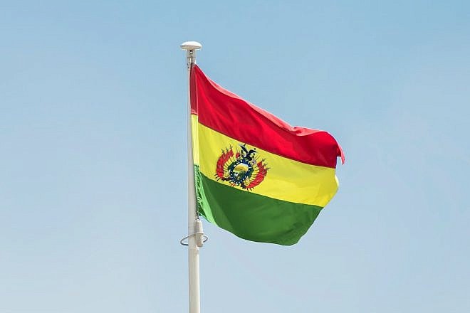 The flag of Bolivia. Photo by Aboodi Vesakaran/Pexels.