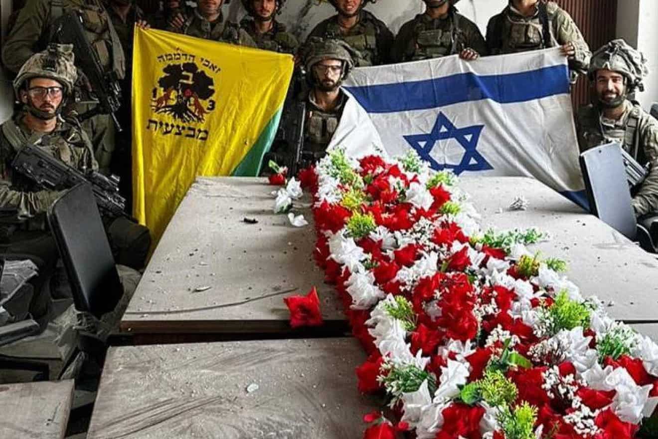 A picture circulating online shows IDF Golani Brigade soldiers displaying the Israeli flag inside Hamas’s police headquarters in the Gaza Strip, Nov. 14, 2023. Credit: Twitter.