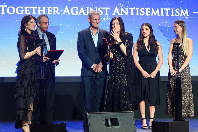 StandWithUs CEO Roz Rothstein (center) presents awards at the nonprofit's annual gala in Los Angeles to two survivors of the Oct. 7 Hamas terror attacks in Israel, as well as a hero who saved lives that day, Dec. 10, 2023. Credit: Michal Mivzari/Jonah Light Photography.