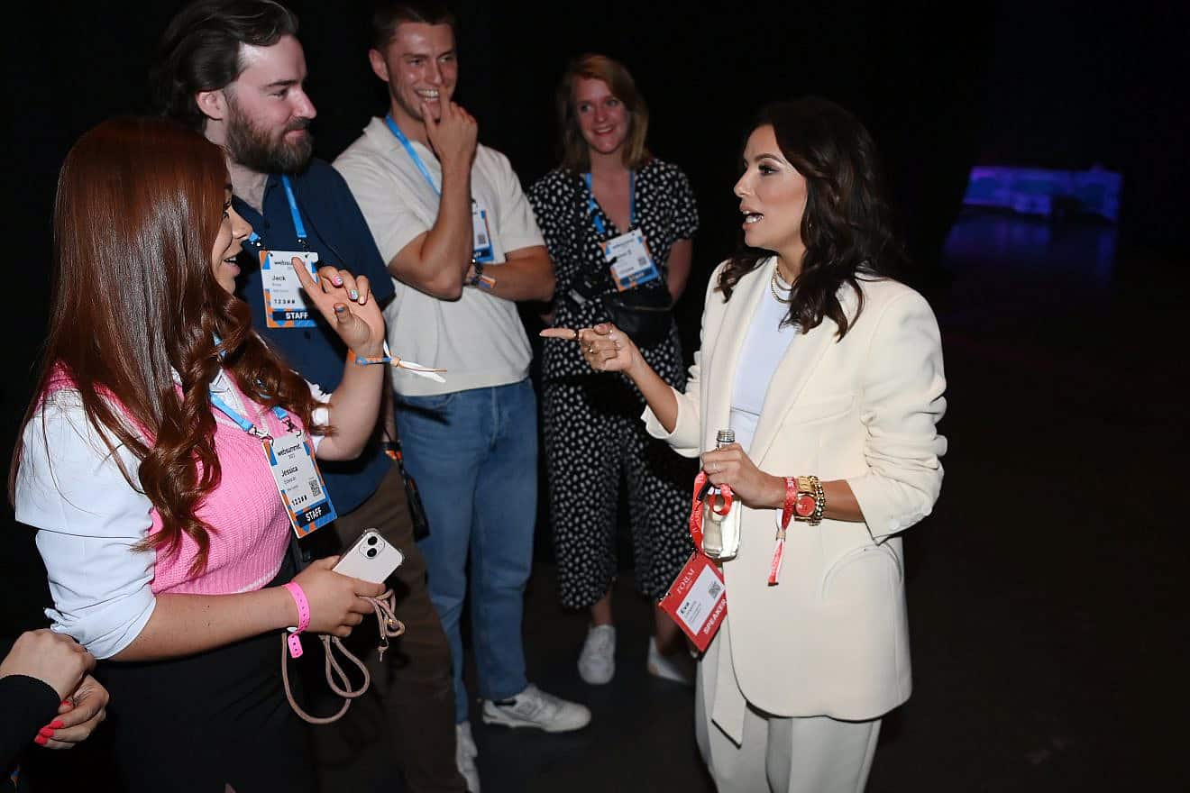 Web Summit staff and Eva Longoria (right) during day three of Web Summit 2022 at the Altice Arena in Lisbon, Portugal. Photo by Stephen McCarthy/Web Summit via Sportsfile.