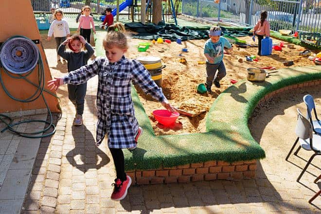 Staff and kids take part in a missile attack drill during a national IDF Home Front Command drill at Batra Kindergarten in Katzrin, the Golan Heights, Feb. 22, 2023. Photo by Michael Giladi/Flash90.