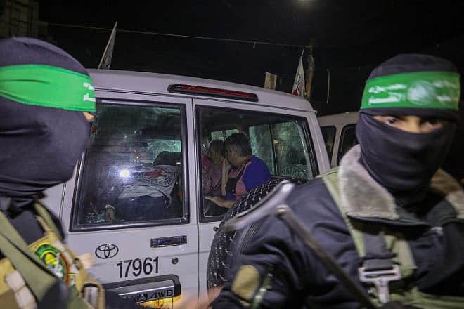 Members of Hamas and the Islamic Jihad release Israeli hostages to the Red Cross in Rafah in the southern Gaza Strip, Nov. 28, 2023. Photo by Flash90.