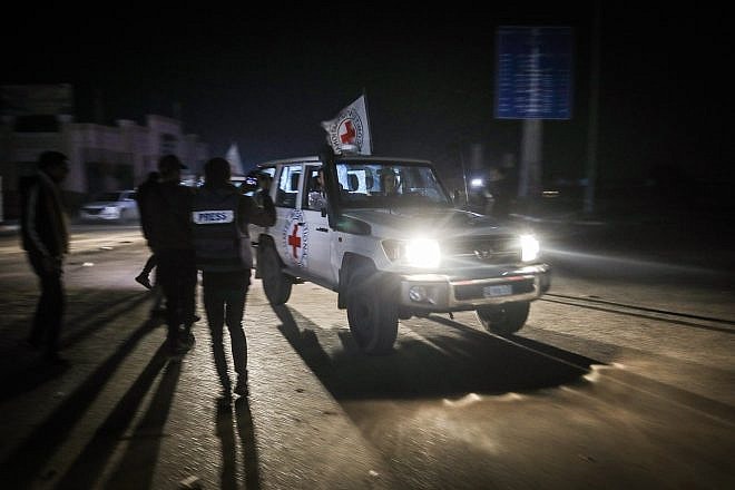 Red Cross vehicles with released hostages arrive at the Gaza Strip's Rafah Crossing with Egypt, on Nov. 30, 2023. Photo by Abed Rahim Khatib/Flash90.