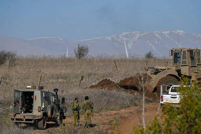 A bulldozer from the IDF's Engineering Corps operates near the Syrian border in the Golan Heights, Dec. 2, 2023. Photo by Michael Giladi/Flash90.