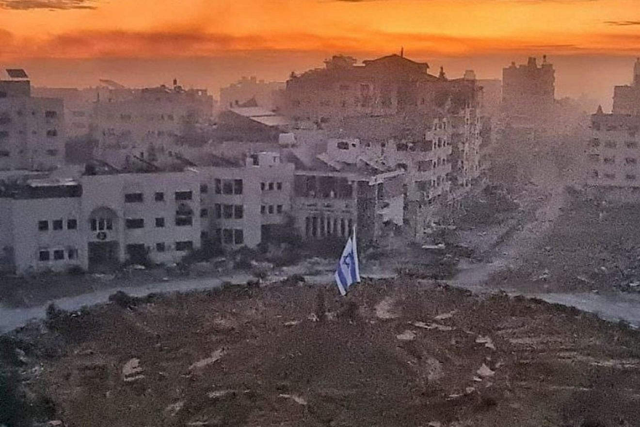 The Israeli flag raised in Gaza City's "Palestine Square." Source: Screenshot.