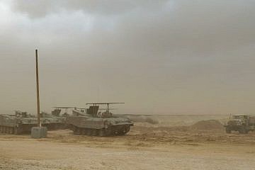 Kfir Brigade soldiers in armored personnel carriers near the Gaza Strip, Dec. 4, 2023. Credit: TPS.