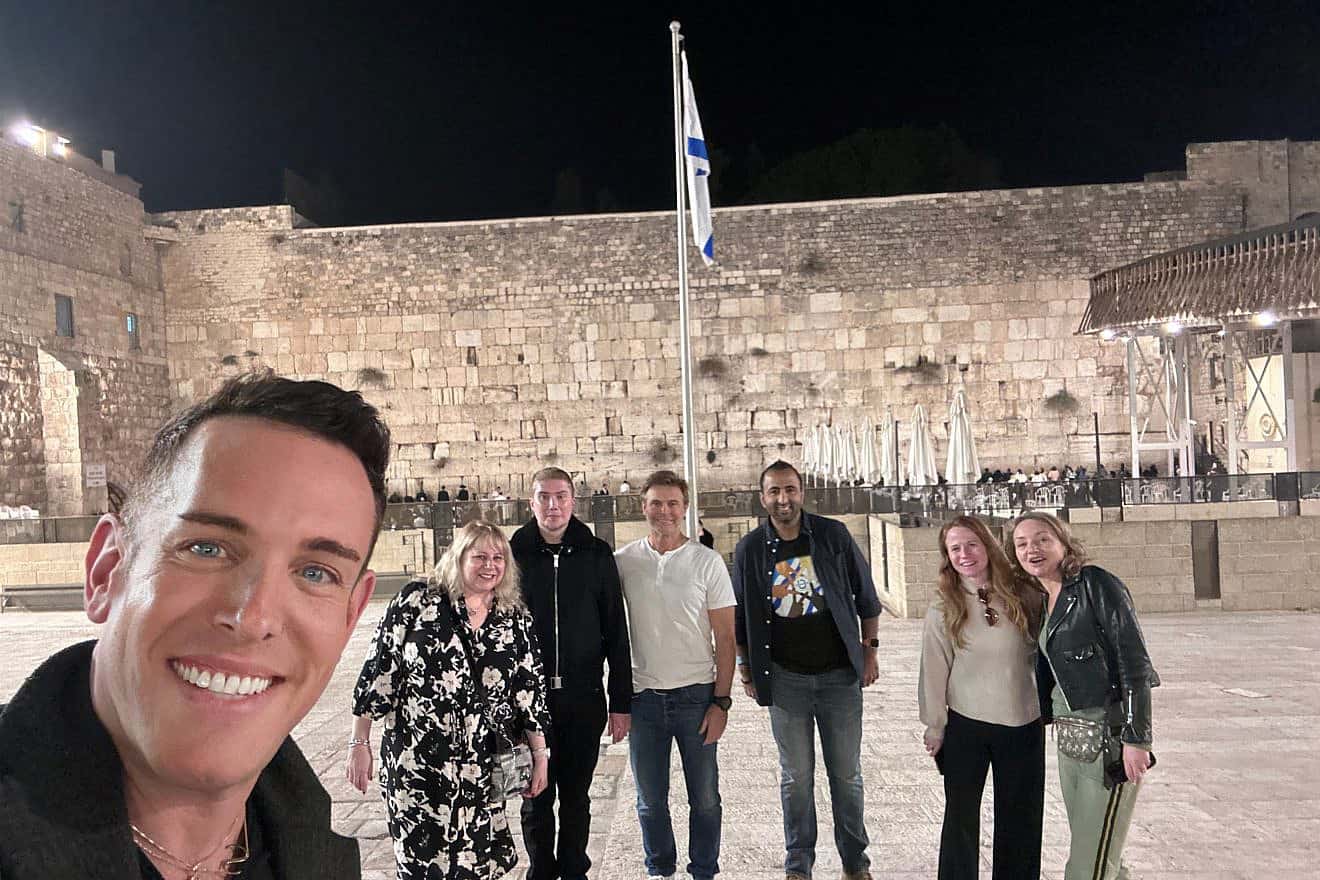 A group of media influencers and journalists who toured Israel as part of a mission led by Shai DeLuca, a Canadian-Israeli interior designer, seen in front of the Western Wall in Jerusalem, Dec. 4 to Dec. 7, 2023. Credit: Courtesy.