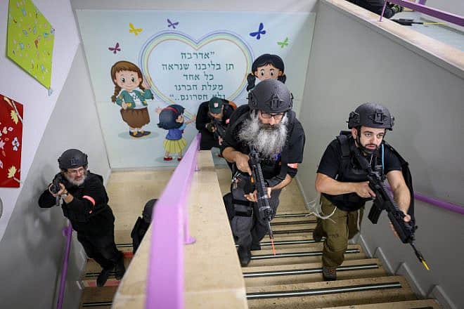 Members of the emergency security squad of Safed take part in a drill at a school, Dec. 6, 2023. Photo by David Cohen/Flash90.