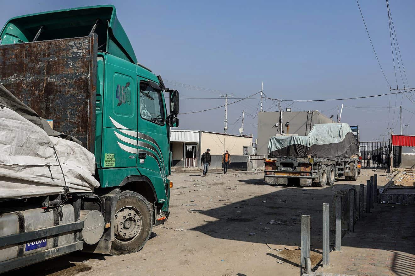 Trucks with Humanitarian aid arrive at the Palestinian side of the Kerem Shalom border crossing in the southern Gaza Strip on Dec. 18, 2023. Photo by Abed Rahim Khatib/Flash90.