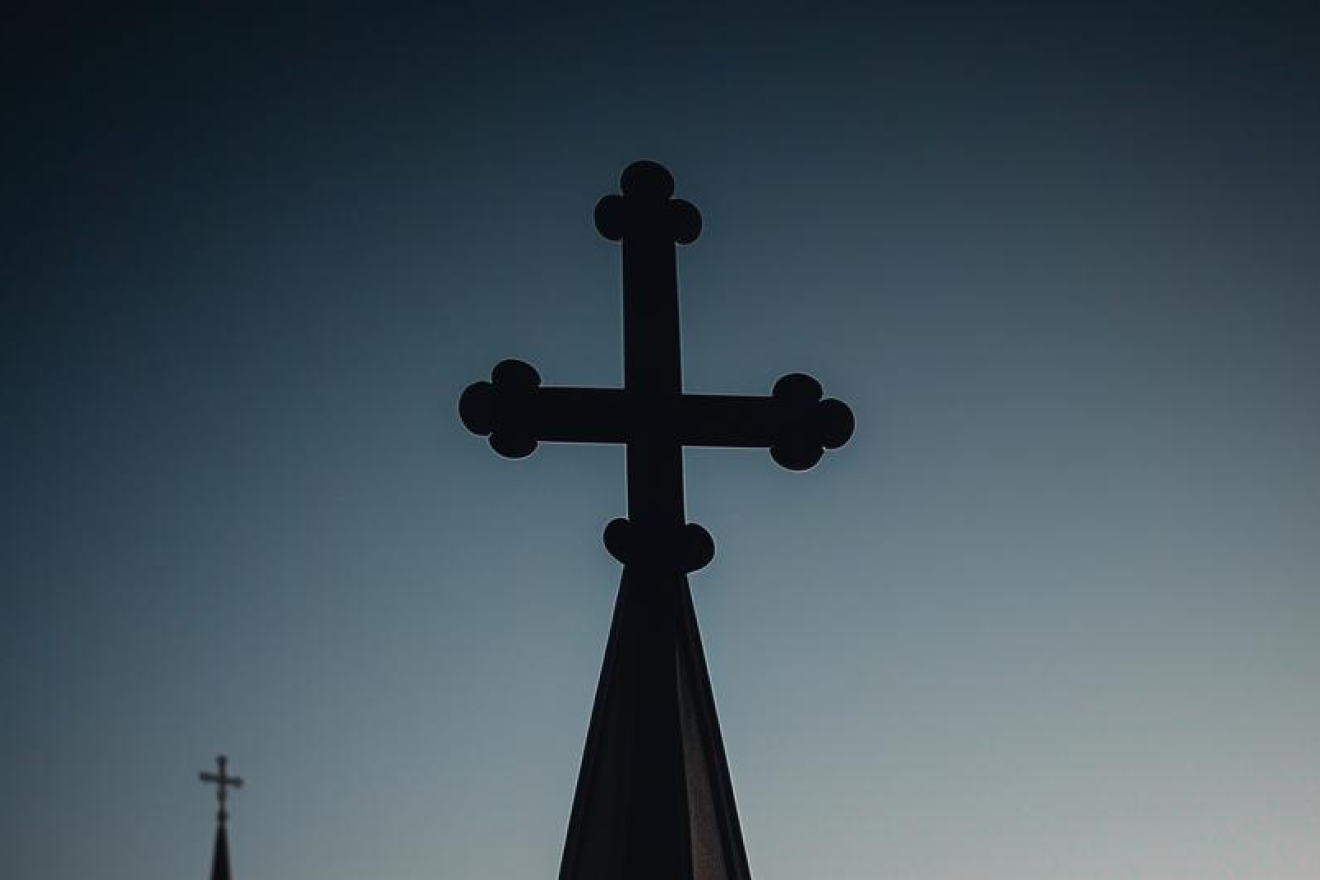A Christian cross on top of a cathedral. Source: Stable Diffusion.