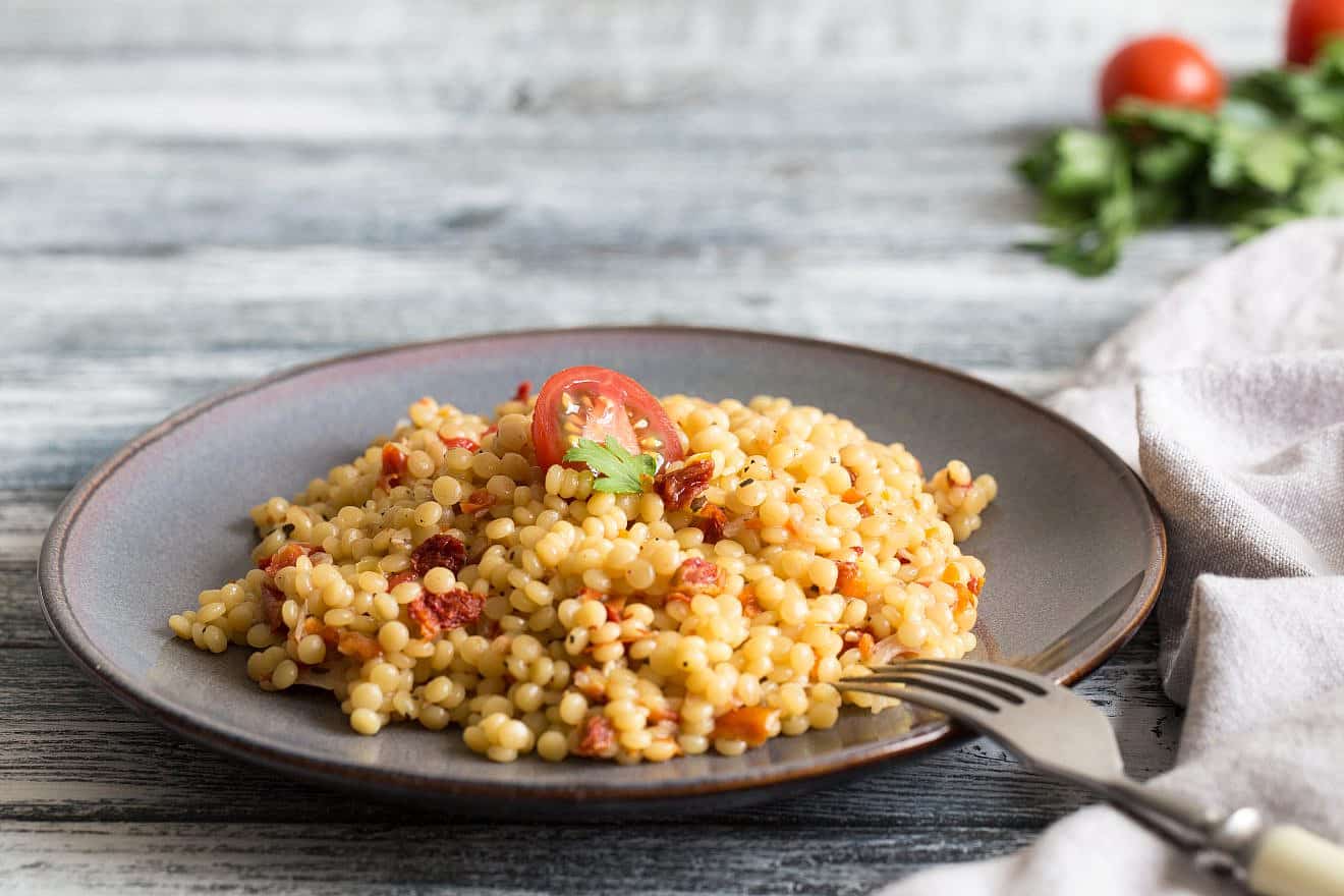 Ptitim or Birdy, Israeli pasta couscous with tomatoes and herbs. Credit: Ivanna Pavliuk/Shutterstock.